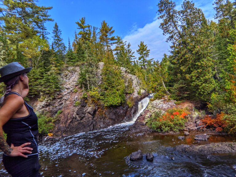 Woman looking at a waterfall