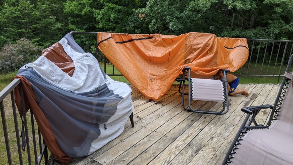 tent drying on a railing