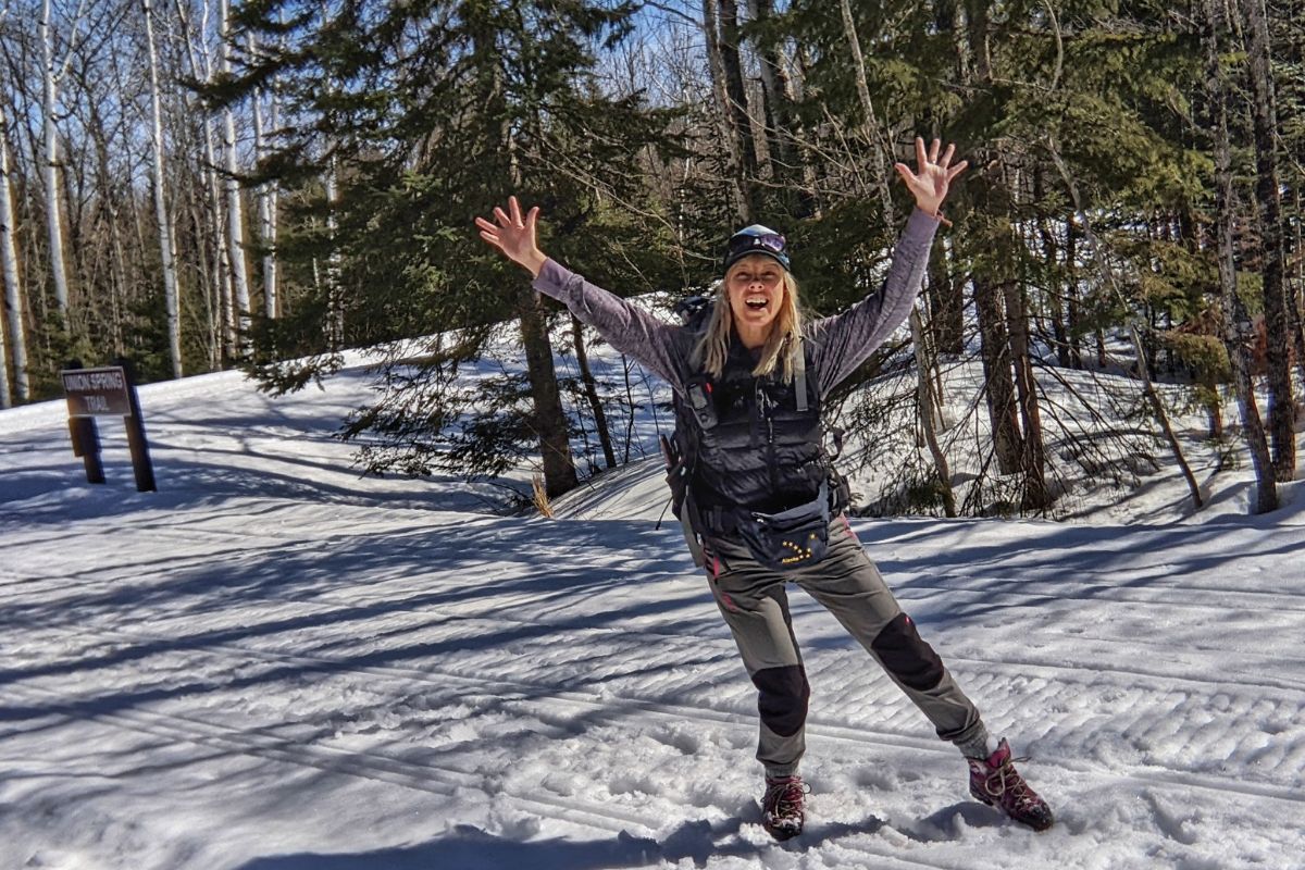 Woman Hiker Dancing in the Snow