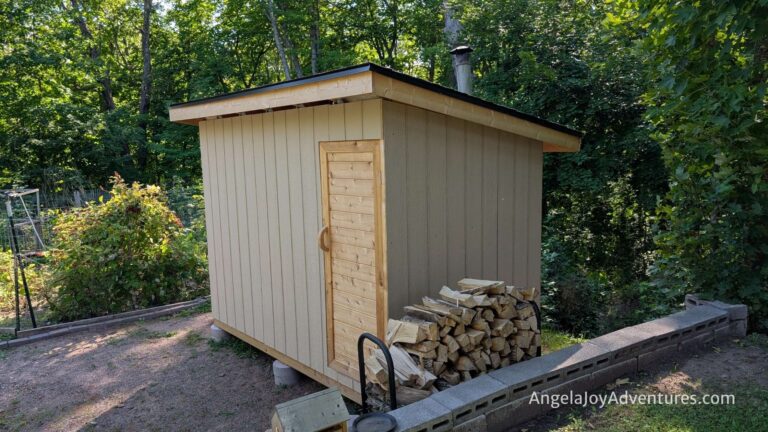 a photo of a small sauna in the woods